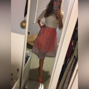 Orange skirt with sheer purple overlay